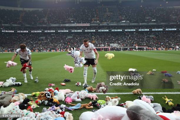 Teddy bears and toys thrown on the field to be sent to the earthquake zone of the Vodafone Park Stadium prior to the Turkish Super Lig soccer match...