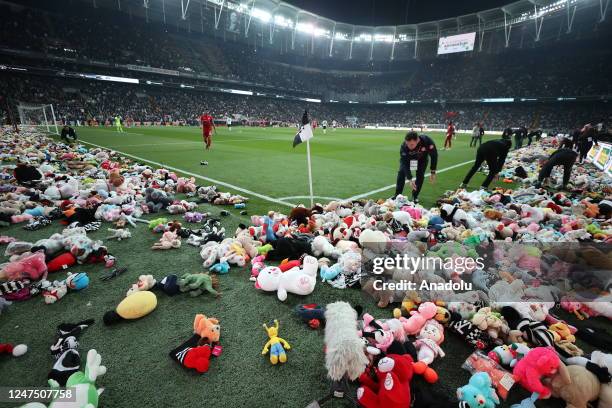 Teddy bears and toys thrown on the field to be sent to the earthquake zone of the Vodafone Park Stadium prior to the Turkish Super Lig soccer match...