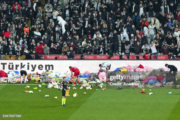 Teddy bears and toys thrown on the field to be sent to the earthquake zone of the Vodafone Park Stadium prior to the Turkish Super Lig soccer match...