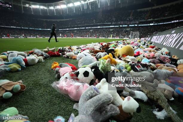 Teddy bears and toys thrown on the field to be sent to the earthquake zone of the Vodafone Park Stadium prior to the Turkish Super Lig soccer match...