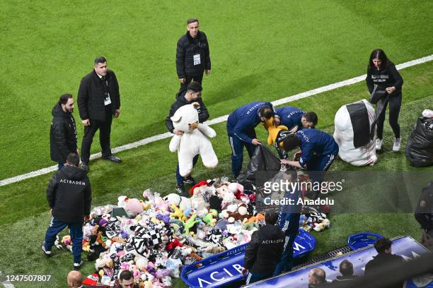 Teddy bears and toys thrown on the field to be sent to the earthquake zone of the Vodafone Park Stadium prior to the Turkish Super Lig soccer match...