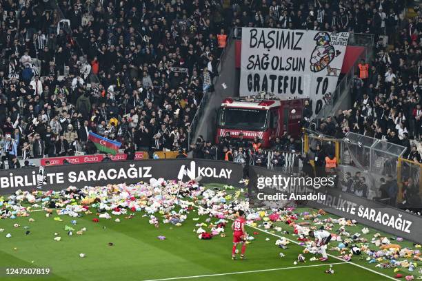 Teddy bears and toys thrown on the field to be sent to the earthquake zone of the Vodafone Park Stadium prior to the Turkish Super Lig soccer match...