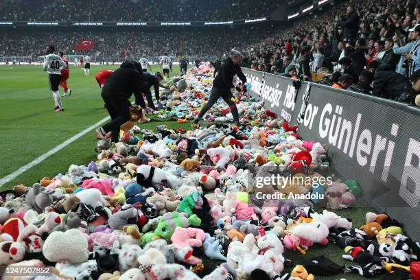 Teddy bears and toys thrown on the field to be sent to the earthquake zone of the Vodafone Park Stadium prior to the Turkish Super Lig soccer match...