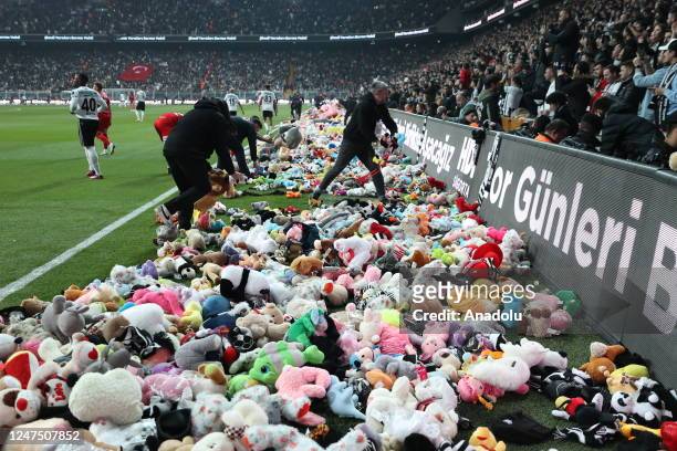 Teddy bears and toys thrown on the field to be sent to the earthquake zone of the Vodafone Park Stadium prior to the Turkish Super Lig soccer match...