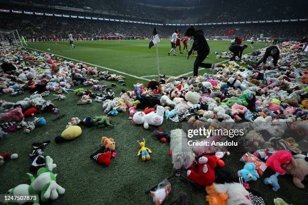 Teddy bears and toys thrown on the field to be sent to the earthquake zone of the Vodafone Park Stadium prior to the Turkish Super Lig soccer match...