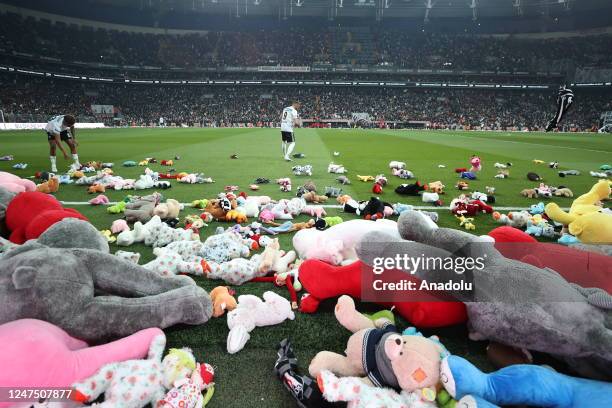 Teddy bears and toys thrown on the field to be sent to the earthquake zone of the Vodafone Park Stadium prior to the Turkish Super Lig soccer match...