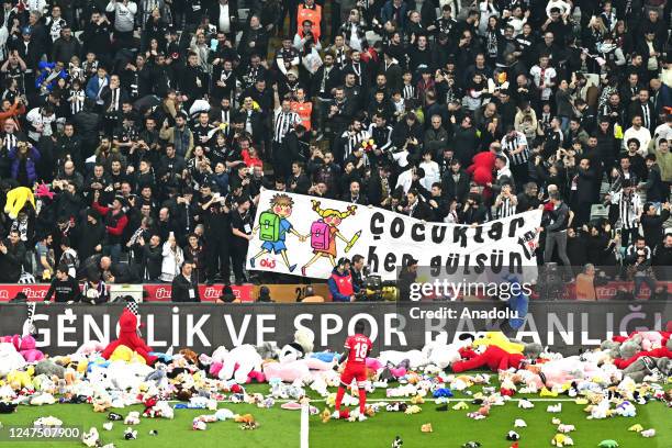 Teddy bears and toys thrown on the field to be sent to the earthquake zone of the Vodafone Park Stadium prior to the Turkish Super Lig soccer match...