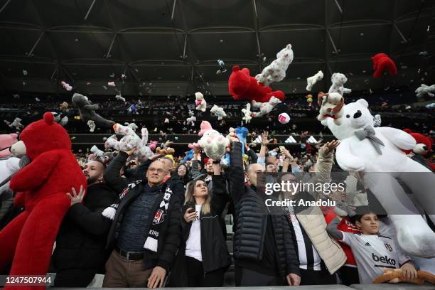 Teddy bears and toys thrown on the field to be sent to the earthquake zone of the Vodafone Park Stadium prior to the Turkish Super Lig soccer match...