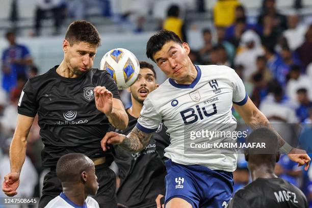 Hilal's South Korean defender Jang Hyun-soo and Duhail's Argentine defender Federico Fernandez vie for the ball during the AFC Champions League...