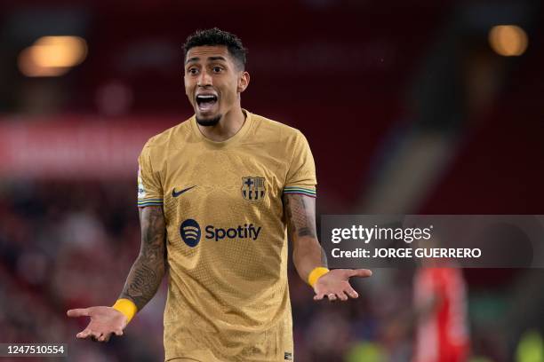 Barcelona's Brazilian forward Raphinha reacts during the Spanish League football match between UD Almeria and FC Barcelona at the Municipal Stadium...