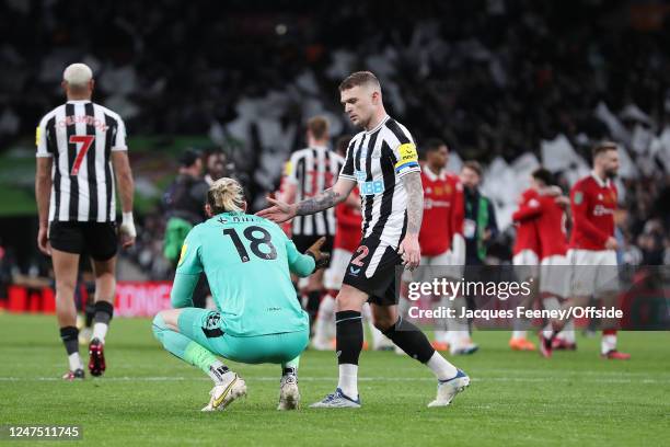 Kieran Trippier of Newcastle United consoles a dejected Newcastle United goalkeeper Loris Karius after the Carabao Cup Final match between Manchester...