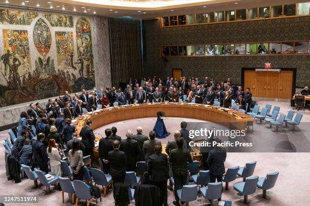 Members of the Security Council, delegations, and guests stand in a moment of silence in memory of people killed on the Russian side during the war...