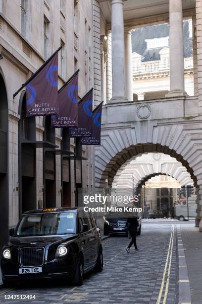 Taxi waiting outside the Hotel Cafe Royal on 8th Febuary 2023 in London, United Kingdom. The Hotel Cafe Royal is a five-star hotel at 68 Regent...