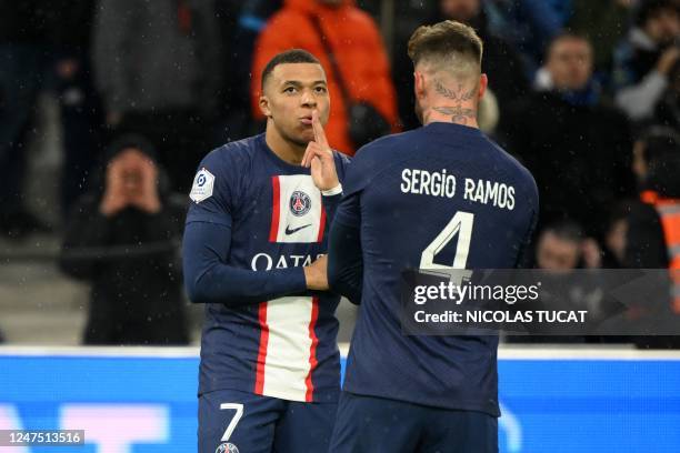 Paris Saint-Germain's French forward Kylian Mbappe celebrates after scoring his team's first goal during the French L1 football match between...