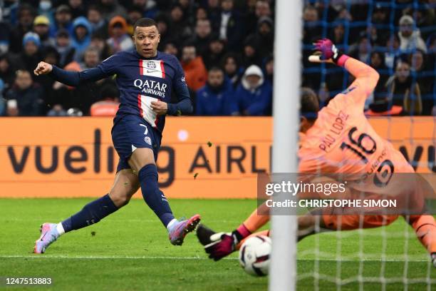 Paris Saint-Germain's French forward Kylian Mbappe scores his team's third goal during the French L1 football match between Olympique Marseille and...