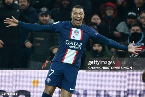 Paris Saint-Germain's French forward Kylian Mbappe celebrates after scoring his team's third goal during the French L1 football match between...