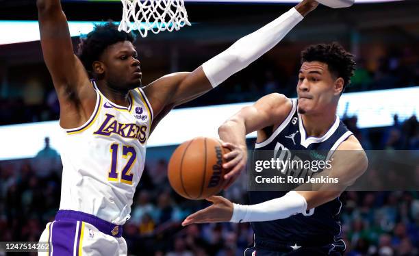 Josh Green of the Dallas Mavericks passes the ball around Mo Bamba of the Los Angeles Lakers in the first half of the game at American Airlines...