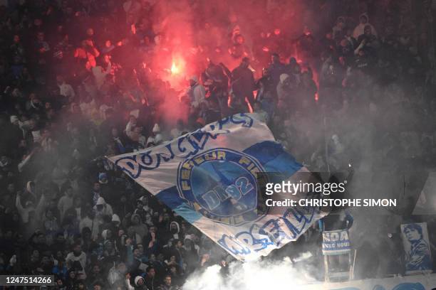 Marseille's supporters deploy a giant flag during the French L1 football match between Olympique Marseille and Paris Saint-Germain at the Velodrome...