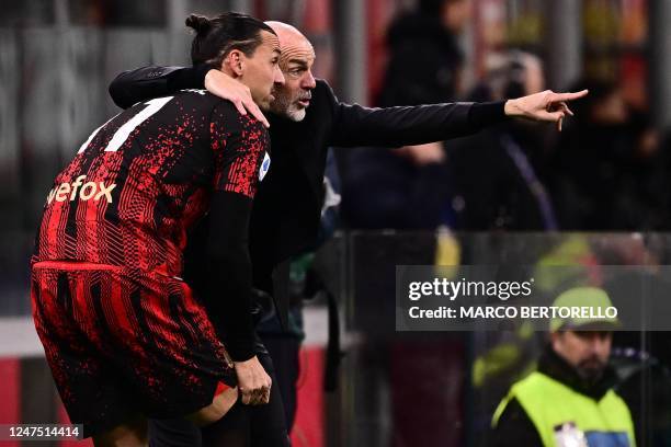 Milan's Italian coach Stefano Pioli gives instructions to AC Milan's Swedish forward Zlatan Ibrahimovic during the Italian Serie A football match...