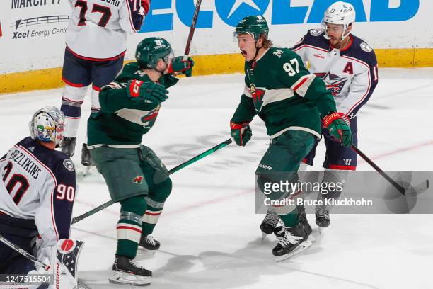 Kirill Kaprizov celebrates his game winning goal with Calen Addison of the Minnesota Wild against the Columbus Blue Jackets during the game at the...