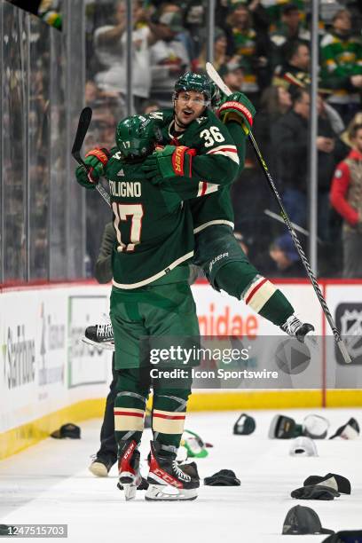 Minnesota Wild Right Wing Marcus Foligno celebrates a victory by lifting Minnesota Wild Right Wing Mats Zuccarello over his head as he leaves the ice...