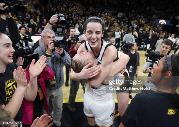 Guard Caitlin Clark of the Iowa Hawkeyes celebrates with forward Monika Czinano after their match-up against the Indiana Hoosiers at Carver-Hawkeye...