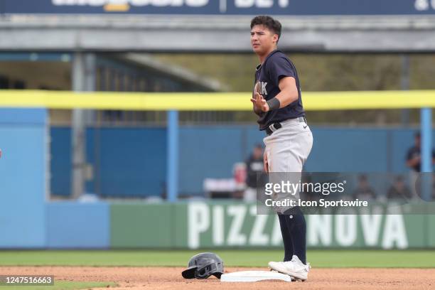New York Yankees infielder Anthony Volpe asks for time while standing on second base during the spring training game between the New York Yankees and...