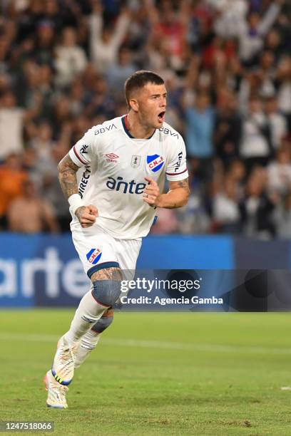 Juan Ignacio Ramírez of Nacional celebrates after scoring the first goal of the team during a match between Nacional and Racing de Montevideo as part...