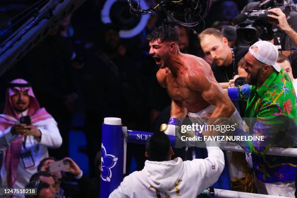 British reality TV star Tommy Fury celebrates after he won by split decision against US YouTuber Jake Paul in a boxing match held at Diriyah in...