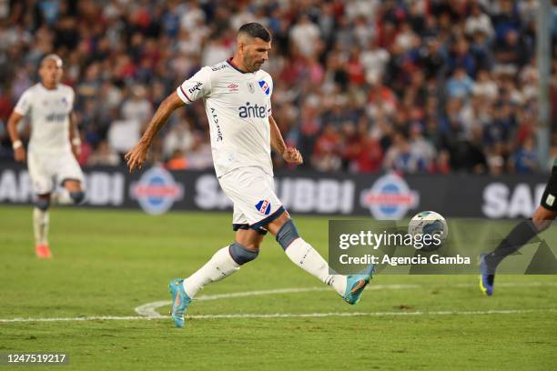 Emmanuel Gigliotti of Nacional scores the third goal of the team during a match between Nacional and Racing de Montevideo as part of Torneo Apertura...