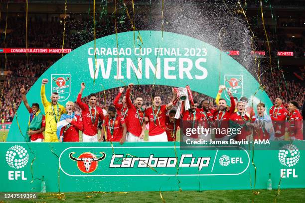 Harry Maguire and Bruno Fernandes of Manchester United lift the Carabao Cup trophy after the Carabao Cup Final match between Manchester United and...