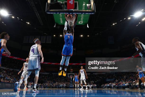 Luguentz Dort of the Oklahoma City Thunder dunks the ball during the game against the Sacramento Kings on February 26, 2023 at Paycom Arena in...