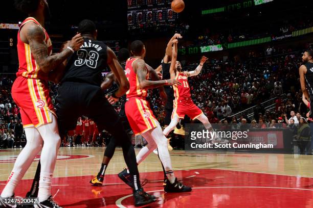 Trae Young of the Atlanta Hawks shoots the ball to win the game against the Brooklyn Nets on February 28, 2023 at State Farm Arena in Atlanta,...