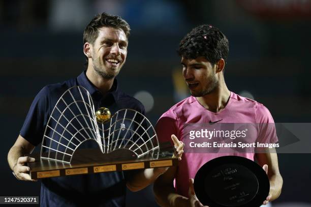 Cameron Norrie of Great Britain rises the Rio Open Trophy after winning Carlos Alcaraz of Spain during the final day of ATP 500 Rio Open presented by...