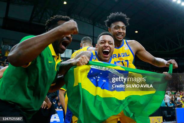 Brazil's Yago dos Santos and Bruno Caboclo celebrate after defeating the USA at the end of their FIBA Basketball World Cup 2023 Americas qualifiers...