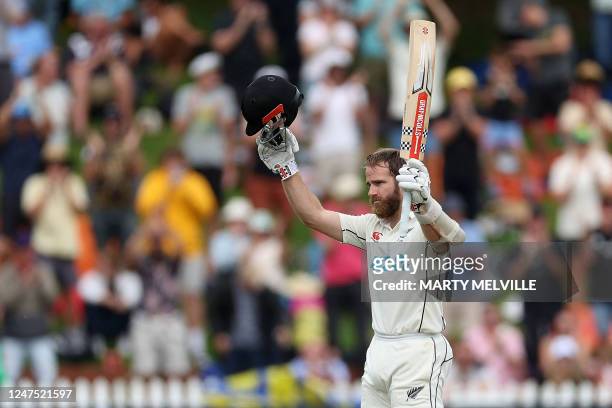 New Zealand's Kane Williamson celebrates 100 runs during day four of the second cricket Test match between New Zealand and England at the Basin...