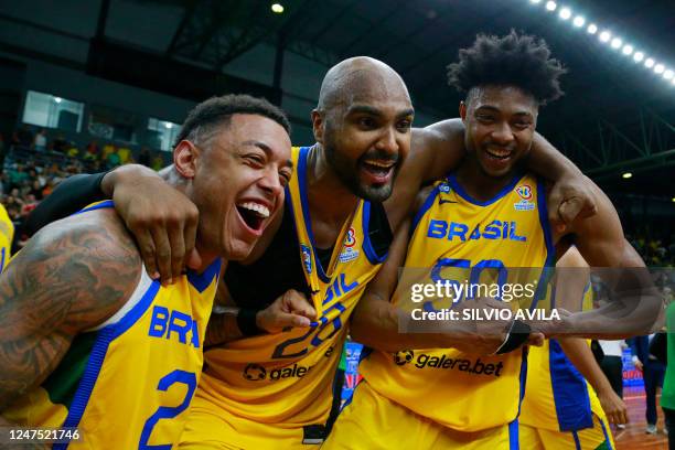 Brazil's Yago dos Santos, Lucas Mariano and Bruno Caboclo celebrate after defeating the USA at the end of their FIBA Basketball World Cup 2023...