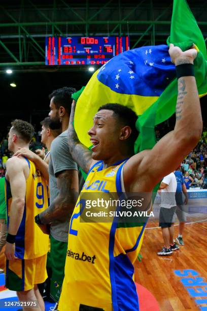 Brazil's Yago dos Santos celebrates after defeating the USA at the end of their FIBA Basketball World Cup 2023 Americas qualifiers match at the Arnão...