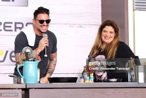 Gabriele Bertaccini and Alex Guarnaschelli are seen during a demonstration at the South Beach Wine and Food Festival Grand Tasting on February 26,...