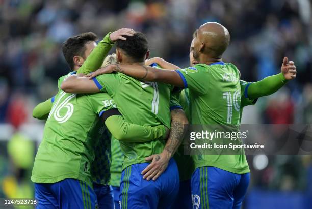 Seattle Sounders celebrate Seattle midfielder Cristian Roldan and his first half goal during an MLS match between the Seattle Sounders and the...
