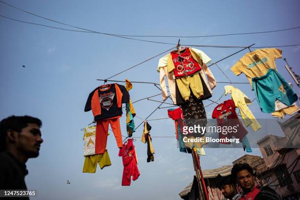 Shopkeeper waits for customers at his apparel shop at a market in New Delhi, India, on Sunday, Feb. 26, 2023. Indias GDP growth likely slowed to 4.6%...
