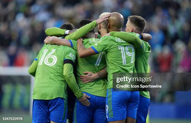 Seattle Sounders celebrate Seattle midfielder Cristian Roldan and his first half goal during an MLS match between the Seattle Sounders and the...