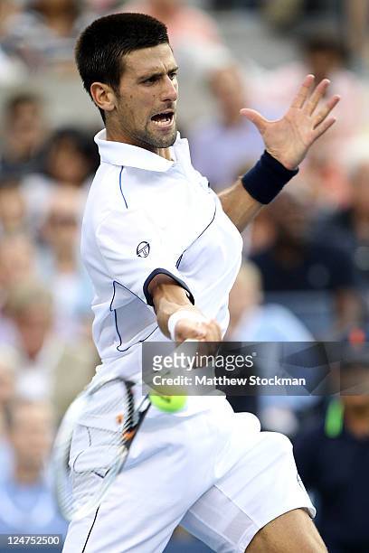Novak Djokovic of Serbia hits a return against Rafael Nadal of Spain during the Men's Final on Day Fifteen of the 2011 US Open at the USTA Billie...