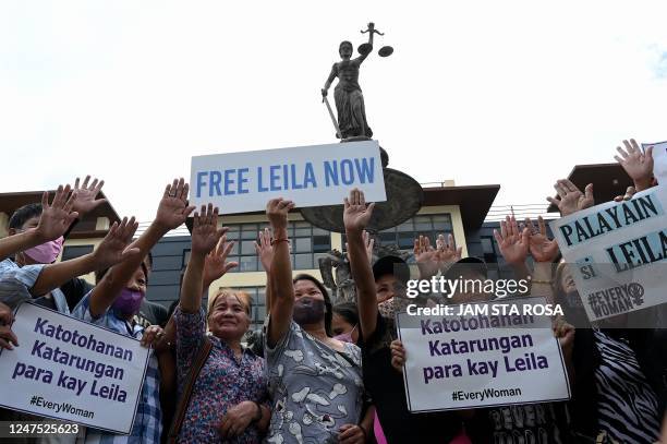 Supporters of former Philippine senator and human rights campaigner Leila de Lima, hold a demonstration at the Muntinlupa Trial Court in Manila on...