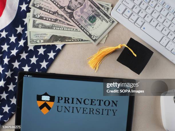 In this photo illustration, Princeton University logo seen displayed on a tablet.