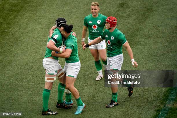 James Ryan of Ireland celebrates with team mates James Lowe, Craig Casey and Josh van der Flier after scoring a try during the Six Nations rugby...