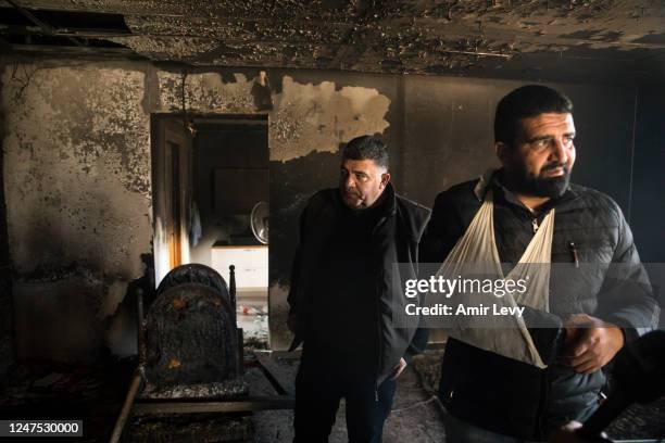 Ammar Demadi stands in his burned house after settlers riot and set houses and cars on fire in the village of Hawara on February 27, 2023 in Hawara,...