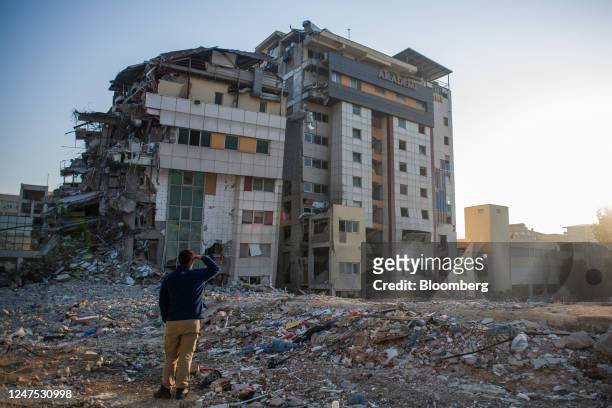 Resident looks at a destroyed hospital building in Hatay, Turkey, on Sunday, Feb. 26, 2023. Turkish President Recep Tayyip Erdogan said around 2.2...
