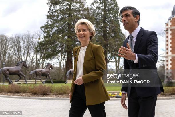 Britain's Prime Minister Rishi Sunak walks with European Commission chief Ursula von der Leyen as she arrives at the Fairmont Hotel in Windsor, west...