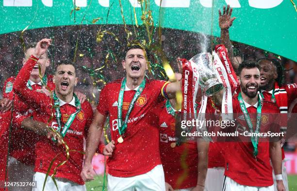 Manchester United's Harry Maguire and Bruno Fernandes lift the trophy during the Carabao Cup Final match between Manchester United and Newcastle...